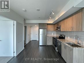 Toronto (Humber Heights) condo for rent - A kitchen with a refrigerator, microwave, oven, and sink.