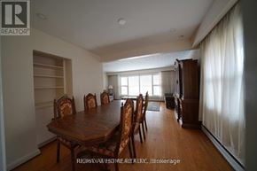 Toronto (Humberlea-Pelmo Park) apartment for rent - A dining room with a wooden table and chairs.