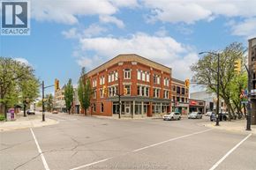 Chatham apartment for rent - A street view of a town with a large building in the middle.