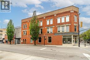 Chatham apartment for rent - A street view of a red brick building with a sign that reads "Sunny Road Jewelers".