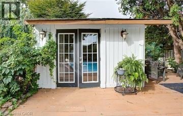 Cambridge apartment for rent - A white house with a pool in the backyard.