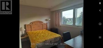 Mississauga (Erin Mills) apartment for rent - A bedroom with a bed, desk, and chair is shown.
