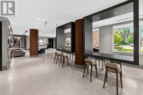 Kitchener condo for rent - A modern office space with a reception desk and chairs.