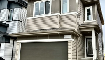 Edmonton apartment for rent - A modern house with a garage door.