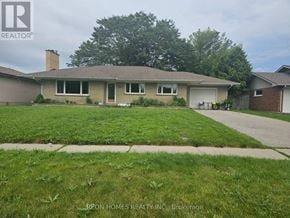 Oshawa (Donevan) apartment for rent - A house with a lawn in front of it.