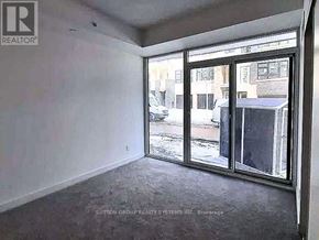 Burlington (Lasalle) condo for rent - A room with a view of a street through a glass door.