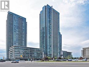Mississauga (City Centre) condo for rent - Two modern glass buildings stand side by side in a city setting.