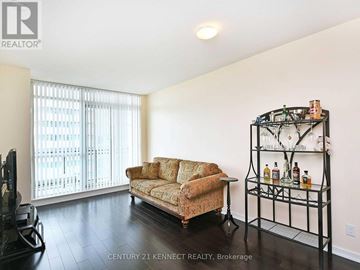 Mississauga (City Centre) condo for rent - A living room with a sofa and a bar cart.