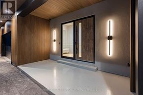 Amaranth apartment for rent - A modern room with a glass door and a wooden wall.
