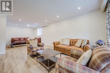 Richmond Hill (Mill Pond) apartment for rent - A living room with a brown couch and a coffee table.