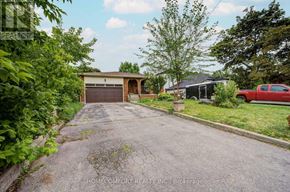 Richmond Hill (Mill Pond) apartment for rent - A red truck is parked in front of a house with a garage.