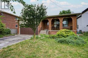 Richmond Hill (Mill Pond) apartment for rent - A house with a brick facade and a tree in front.