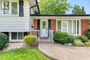 Burlington (Appleby) apartment for rent - A house with a grey front porch and a white door.