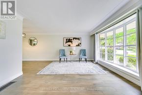 Burlington (Appleby) apartment for rent - A room with a large rug and two chairs.