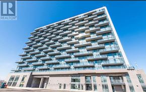Hamilton (Riverdale) condo for rent - A tall residential building with balconies on each floor.