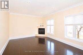 Mississauga (Central Erin Mills) apartment for rent - A room with a fireplace and a window.