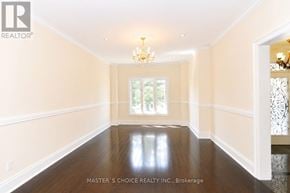 Mississauga (Central Erin Mills) apartment for rent - A spacious room with wood floors and a chandelier.