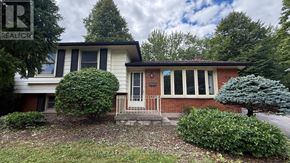 London North (North K) apartment for rent - A house with a red door and a sign that says REALTOR.