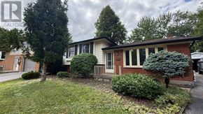 London North (North K) apartment for rent - A house with a red roof and a white fence.