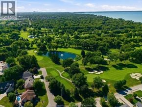 Tecumseh apartment for rent - A bird's eye view of a residential area with a golf course.
