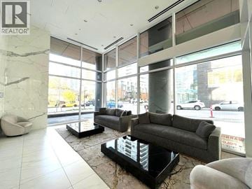 Burnaby apartment for rent - A living room with a grey couch and a black coffee table.