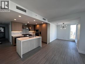 Burnaby apartment for rent - A modern kitchen with a large island in the middle.