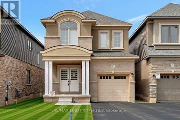 Brantford apartment for rent - A large, two-story house with a garage is for sale.