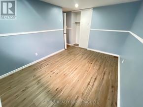 London South (South P) townhouse for rent - A room with wooden flooring and blue walls.