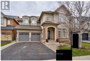 Oakville (Br Bronte) apartment for rent - A house with a sign that says Century 21 Titans Realty Inc., Brokerage.
