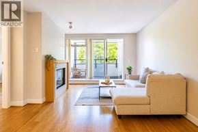Vancouver apartment for rent - A living room with a couch, a television, and a rug.