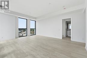 Toronto (Thorncliffe Park) condo for rent - A spacious room with a view of the city through large windows.