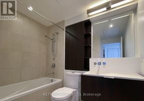 Toronto (Church-Yonge Corridor) condo for rent - A bathroom with a bathtub, toilet, and sink.