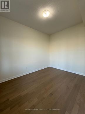 Loyalist (Bath) apartment for rent - A room with wooden flooring and a single light on the ceiling.