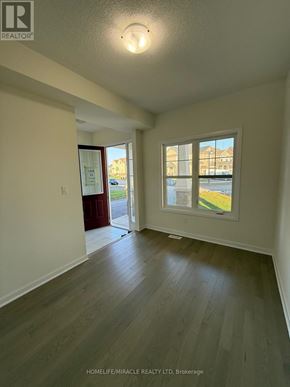 Loyalist (Bath) apartment for rent - A room with wooden floors and a window showing a view of a street.