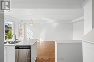 Ottawa townhouse for rent - A white kitchen with a dishwasher and a sink.
