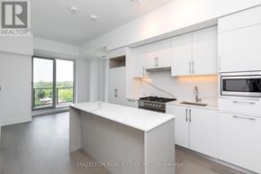 Toronto (Yonge-Eglinton) condo for rent - A modern kitchen with white cabinets and appliances.
