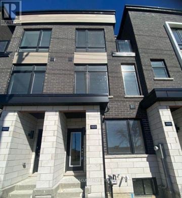 Toronto (Bendale) townhouse for rent - A building with the number 1553 on the front door.