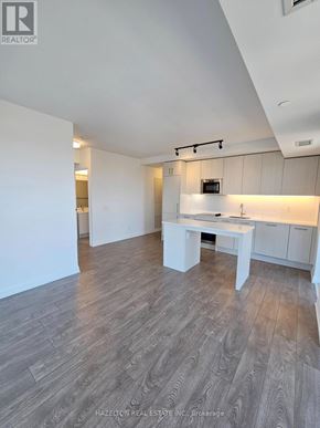 Toronto (East End-Danforth) condo for rent - A kitchen area with a white countertop and cabinets.
