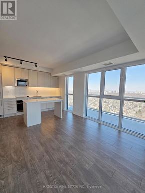 Toronto (East End-Danforth) condo for rent - A spacious kitchen with a view of the city.