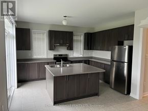 Collingwood apartment for rent - A kitchen with a sink, stove, and refrigerator.