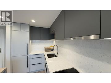 Coquitlam apartment for rent - A modern kitchen with a marble backsplash and stainless steel appliances.