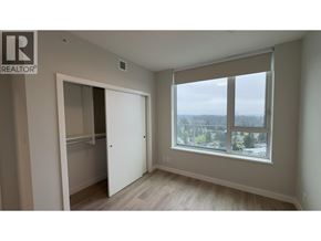 Coquitlam apartment for rent - A room with a large window and a sliding door.