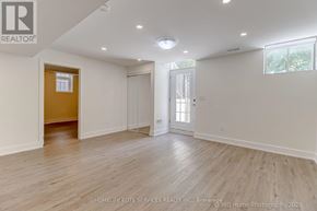 Whitchurch-Stouffville (Stouffville) apartment for rent - A spacious room with wooden flooring and white walls, ready for staging.