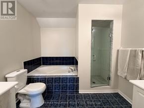 Toronto (East End-Danforth) apartment for rent - A bathroom with a white toilet and a white bathtub.