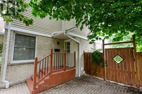 Milton (Tm Timberlea) apartment for rent - A house with a wooden fence and gate is for sale.