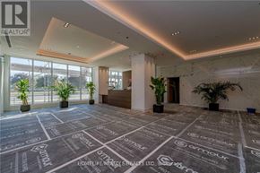 Toronto (High Park-Swansea) condo for rent - A spacious office lobby with a carpeted floor featuring the Armour logo.