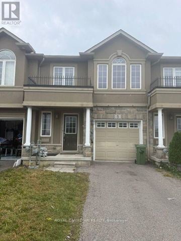 Hamilton (Stoney Creek Mountain) townhouse for rent - A two-story house with a garage and a driveway.