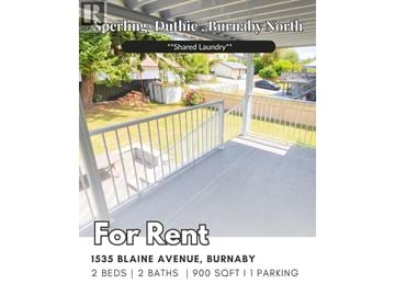 Burnaby apartment for rent - A laundry sign is on the fence of a house.