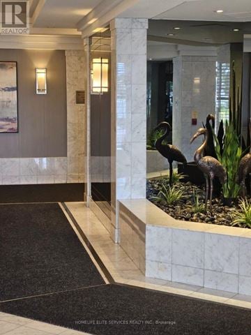 Toronto (Kennedy Park) condo for rent - A hallway with a black and white striped rug and a sign that says REALTOR.