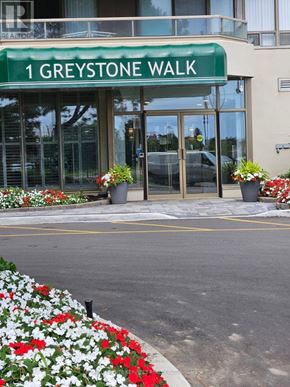 Toronto (Kennedy Park) condo for rent - The entrance to 1 Greystone Walk with a green signboard.